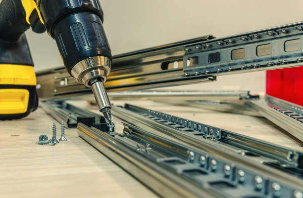 istock Assembling of furniture closeup 857996292