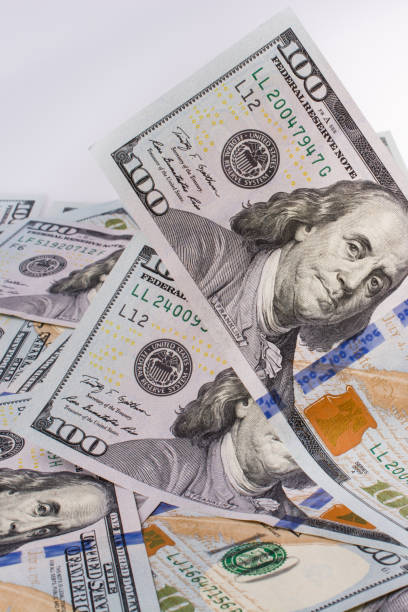 istock Human hand holding American dollar banknotes on white background 857997020
