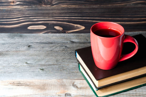 istock Hot coffee or tea, cocoa, chocolate cup on book with copy space for text 857999828