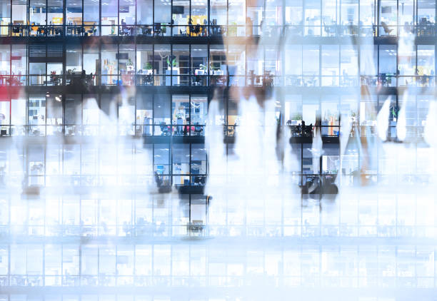 istock People crossing the street and also evening workplace building 857999858