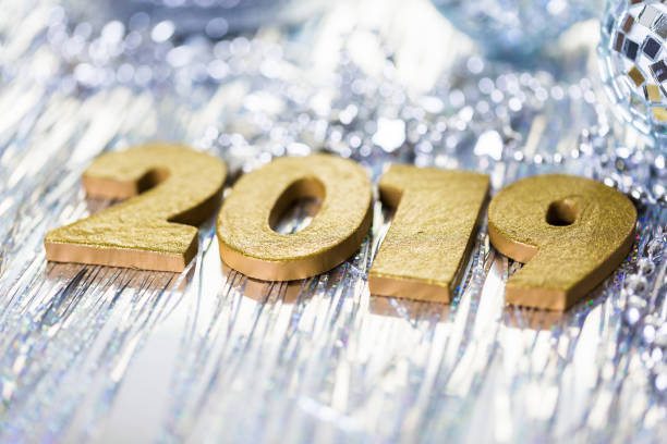 istock Gold numbers of 2019 year on a silver background. 858003076