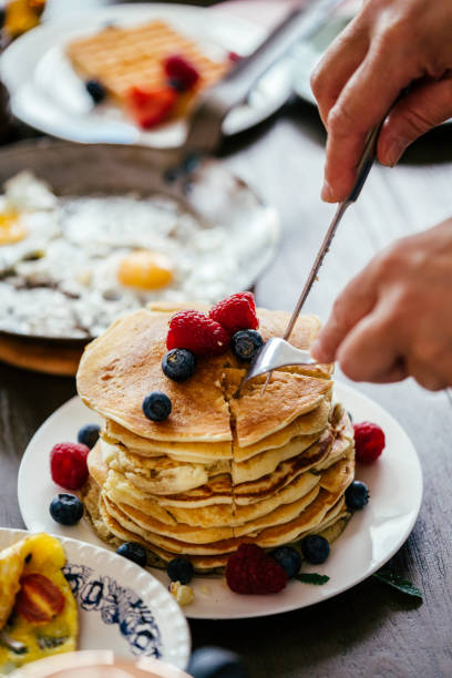 istock Stack of Pancakes with Maple Syrup, Berries and Fresh Coffee 858004850