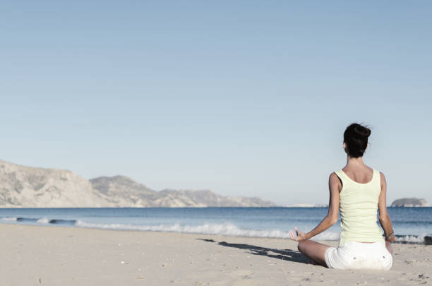 istock Yoga lady beach 858005034