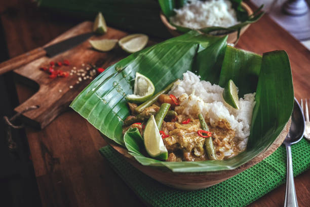 istock Balinese Pork Curry Dish with Jasmine Rice Served on Banana Leave 858007928
