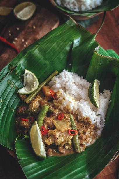 istock Balinese Pork Curry Dish with Jasmine Rice Served on Banana Leave 858007930