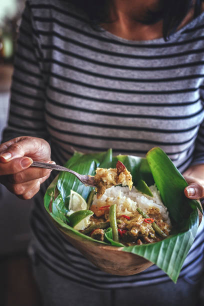 istock Balinese Pork Curry Dish with Jasmine Rice Served on Banana Leave 858007942