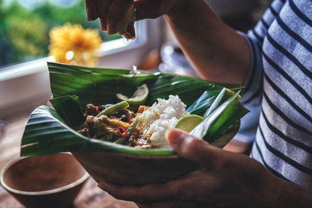istock Balinese Pork Curry Dish with Jasmine Rice Served on Banana Leave 858007946