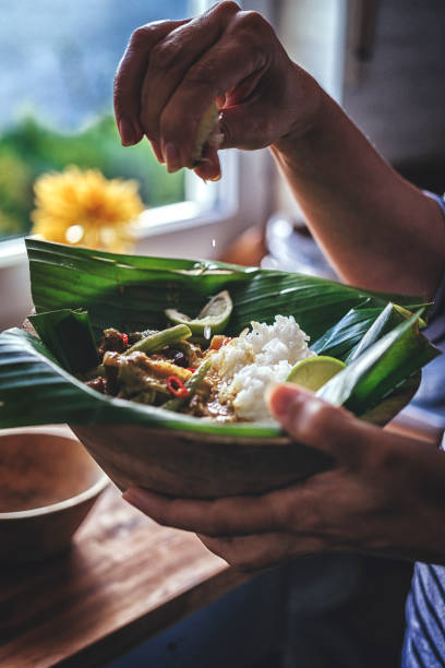 istock Balinese Pork Curry Dish with Jasmine Rice Served on Banana Leave 858007956