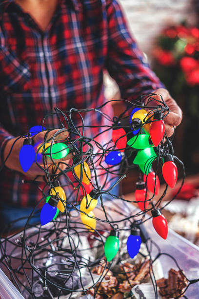 istock Decorating Christmas Tree with Ornaments and Christmas Lights 858008254