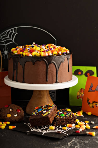 istock Halloween chocolate cake with candy on top 858012324