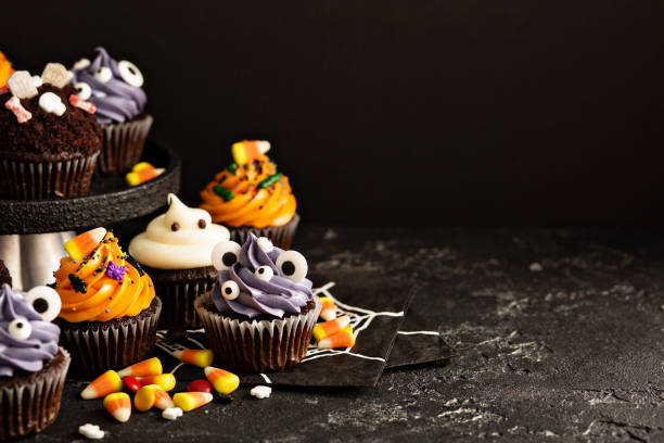 istock Festive Halloween cupcakes and treats 858015416