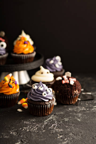 istock Festive Halloween cupcakes and treats 858015520