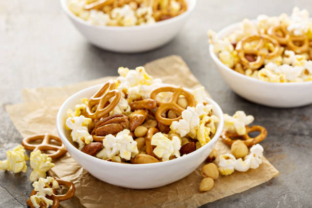 istock Homemade trail mix with popcorn, pretzels and nuts 858017852