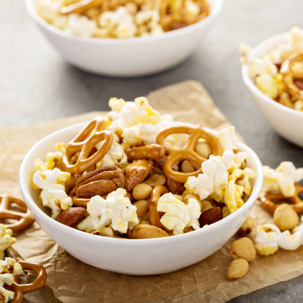 istock Homemade trail mix with popcorn, pretzels and nuts 858017910
