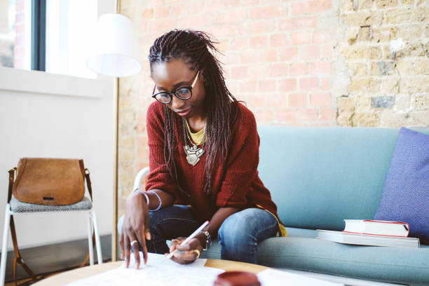 istock Young women working in her apartment 858018156
