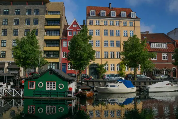 Beautiful reflective canal in Christianshavn area of the cosmopolitan European city of Copenhagen, Denmark.