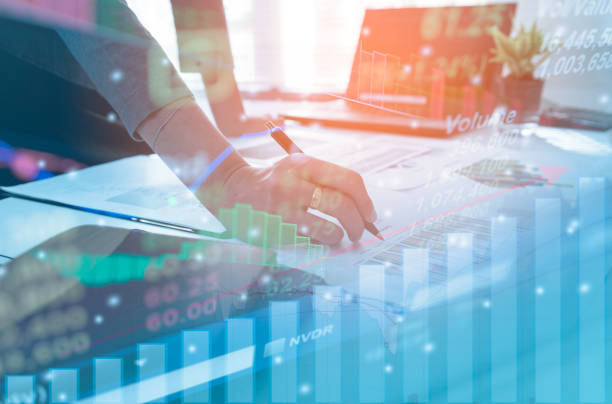 Double exposure business people working at office. Stock markets financial or Investment strategy, Candle stick graph chart of stock market investment trading stock photo