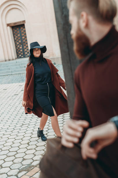 istock young man looking at woman 858034342