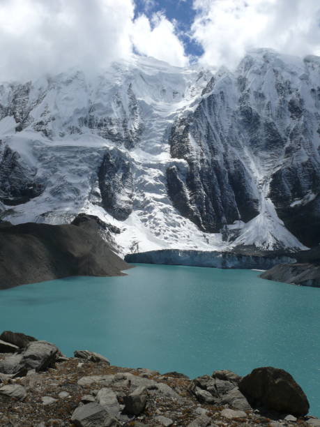 istock Mountain Ice wall falling to the Tilicho lake 858034484