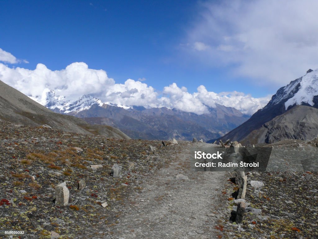 Beautiful mountai path in Himalaya Mountain path to the Tilicho lake surrounded by snow capped Himalayas Adventure Stock Photo