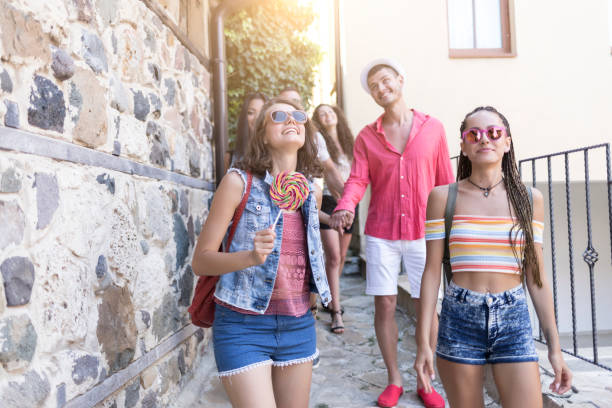 istock Friends walking on street 858038570