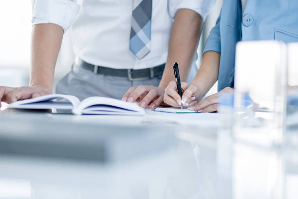 istock Close up, man and woman hands, working on office table 858045536