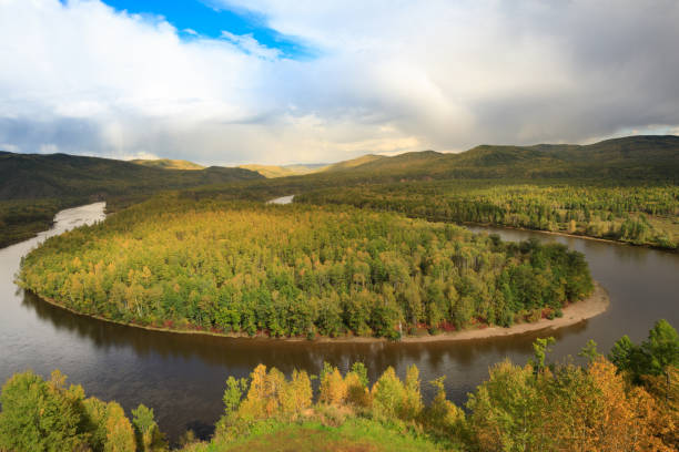 istock beautiful autumn landscape with curving river and forest under blue sky 858045546
