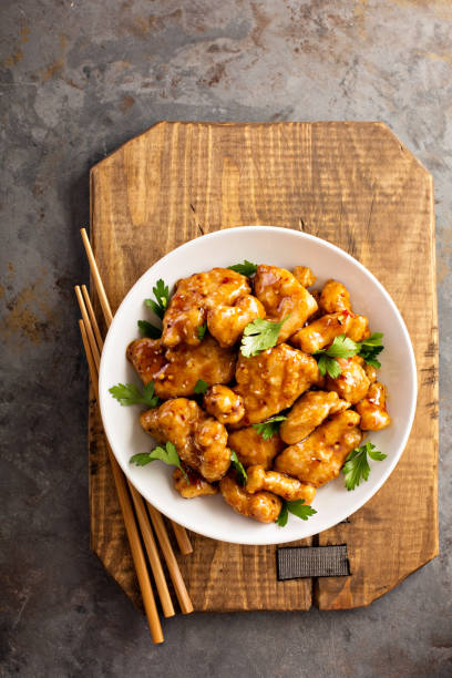 istock Spicy sweet and sour chicken with rice and cabbage 858056312