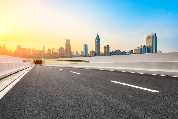 istock Asphalt road and modern cityscape in Shanghai at sunset 858056812