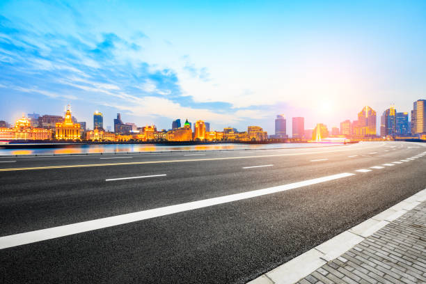 istock Asphalt road and modern cityscape in Shanghai at sunset 858059876