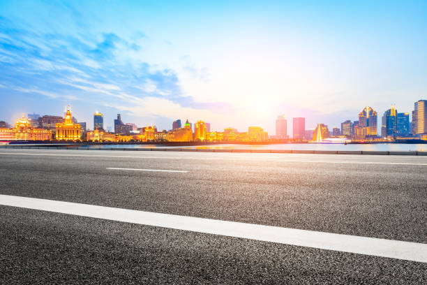 istock Asphalt road and modern cityscape in Shanghai at sunset 858060108