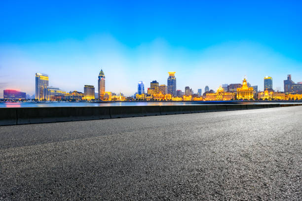 istock Asphalt road and modern cityscape in Shanghai at night 858060694