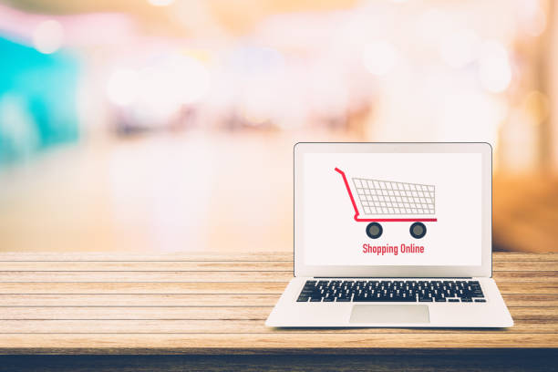 istock shopping online with labtop, notebook on table top and bokeh background, shop with computer. 858060860