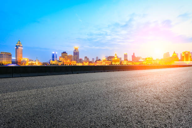 istock Asphalt road and modern cityscape in Shanghai at sunset 858063590