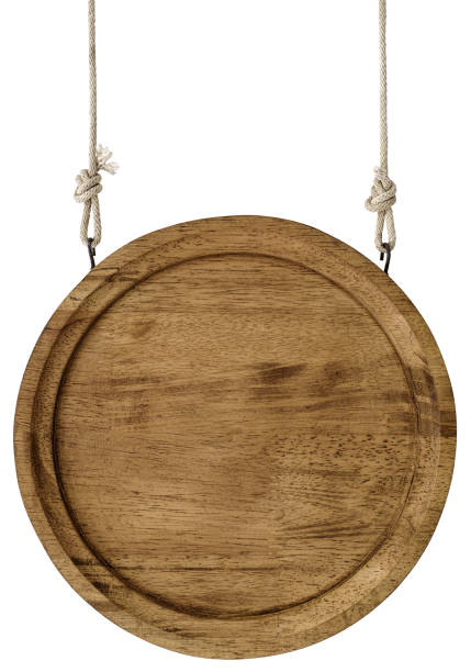 istock Round circular wooden sign hanging by old rope. 858067222