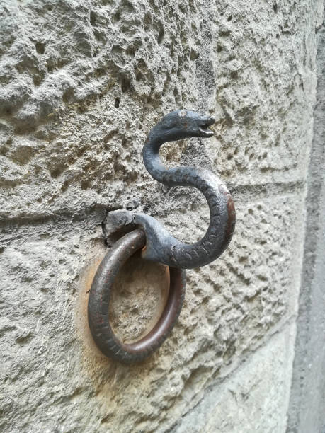 istock Ancient wall metal ring to tie horses 858068702