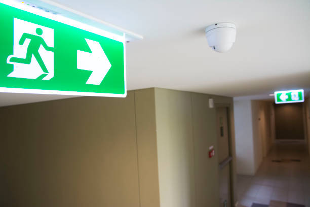 istock Fire escape sign at the corridor 858071936