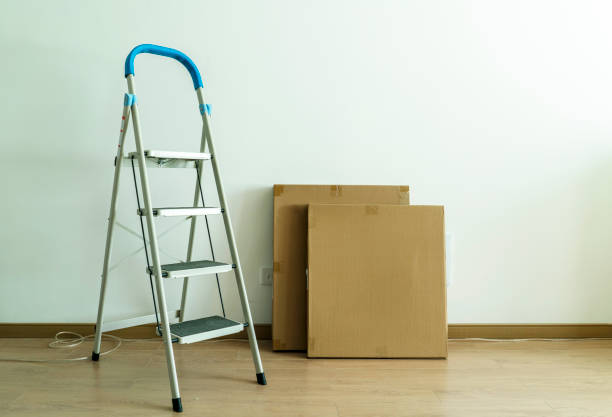 istock furniture cartons piled in empty new house 858076514