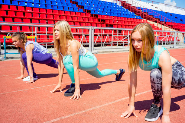istock Girls running on stadium 858076594