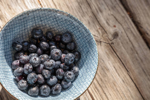 istock Organic blueberries in a blue and white bowl 858087140