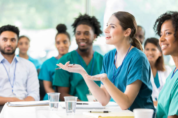istock Group of healthcare professionals participate in panel discussion during conference 858087812