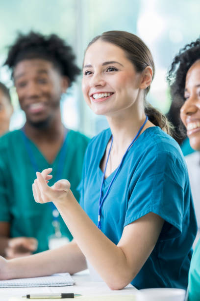 istock Young doctor participates in panel discussion at medical conference 858087844