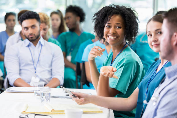 istock Panelists discuss something during healthcare conference 858087856