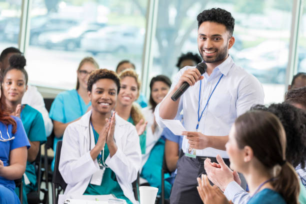 Confident healthcare professionals attend continuing education class
