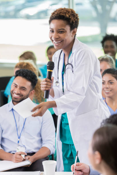 istock Confident African American doctor speaks during continuing education seminar 858087934