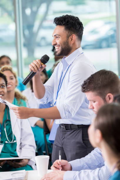 istock Cheerful medical professional participates in panel discussion 858087956