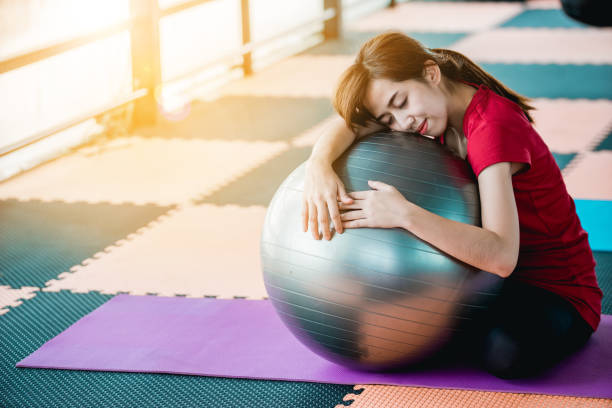istock Girl exercis with a ball 858095220