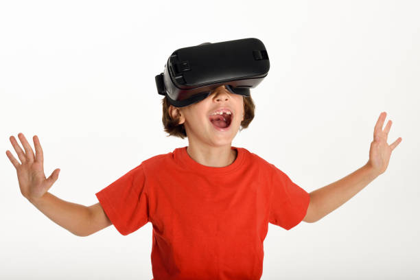 istock Little girl looking in VR glasses and gesturing with his hands. 858096452