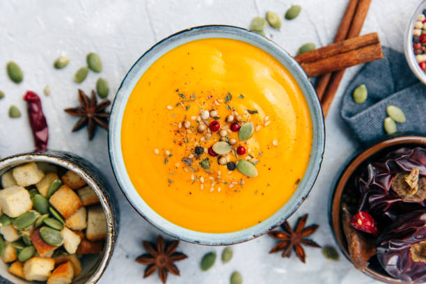 Soup with sweet potatoes, carrots, pumpkin. Flat lay, top view stock photo