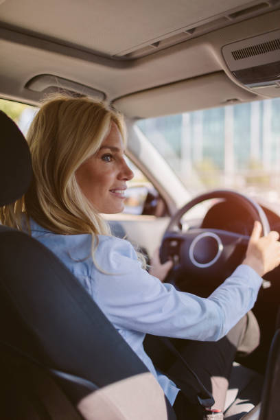 istock Businesswoman driving car 858103552
